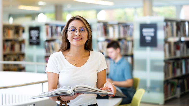 Smiling student in the library